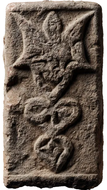 Ancient Carved Stone Artifact with Mythical Symbols