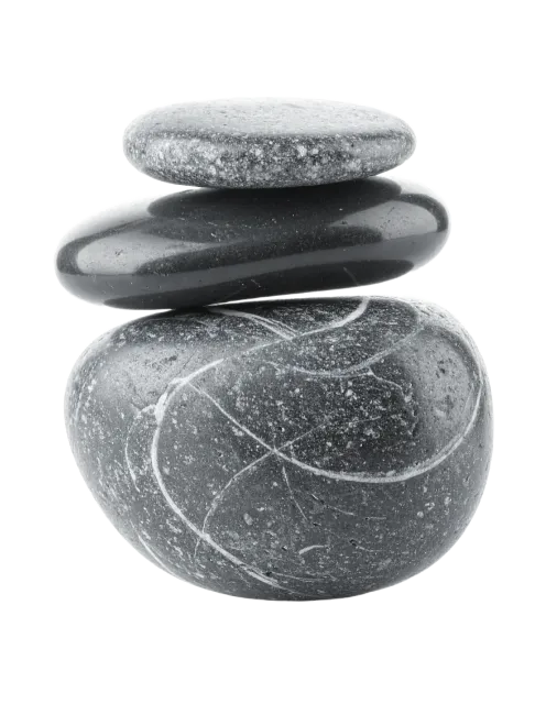 Balanced stack of three dark pebbles