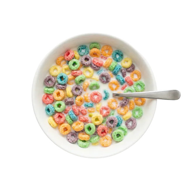 Bowl of colorful fruit cereal with milk