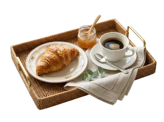 Breakfast tray with croissant and coffee