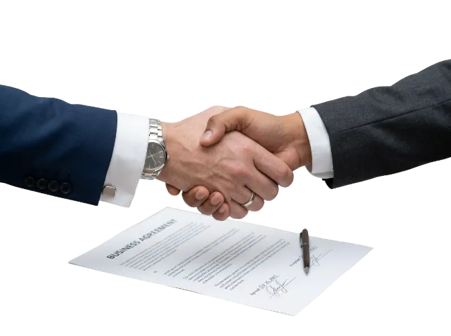 Business Handshake over Agreement Document