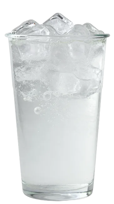 Clear soda drink with ice cubes in a glass