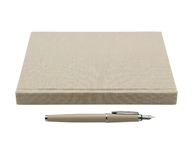 Closed Notebook and Fountain Pen