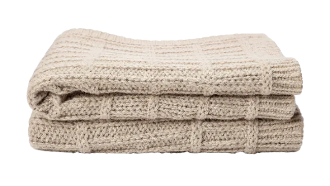 Folded Beige Knitted Blanket