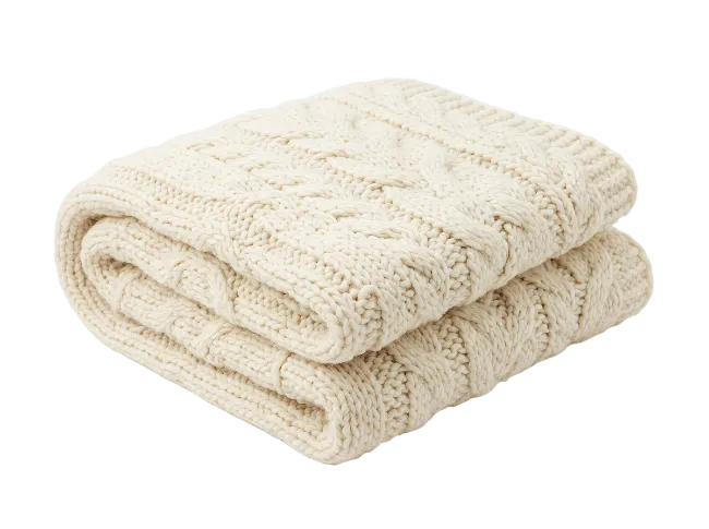 Folded Cream Cable Knit Blanket