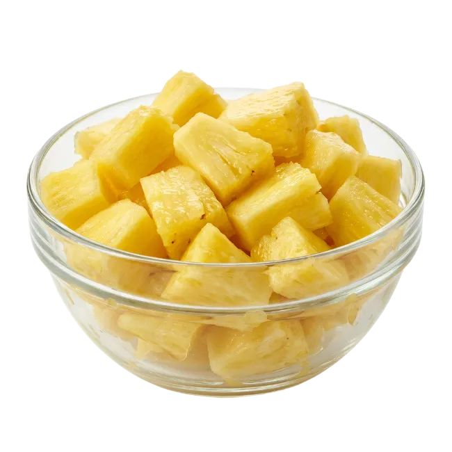 Fresh pineapple chunks in a glass bowl