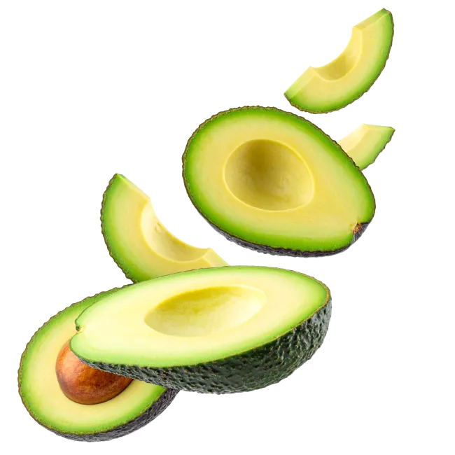 Fresh sliced avocados floating on a black background