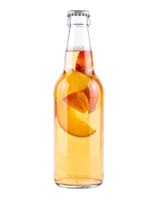 Glass bottle filled with peach juice and fruit slices