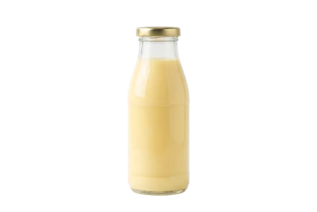 Glass Bottle Filled With Yellow Beverage
