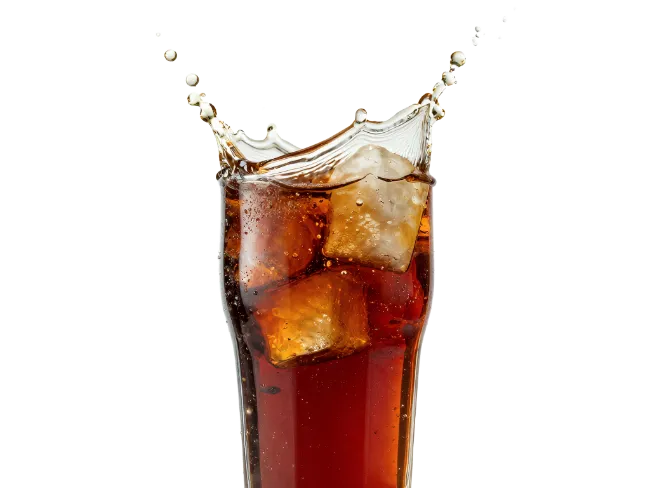 Glass of cola with ice and splashing liquid