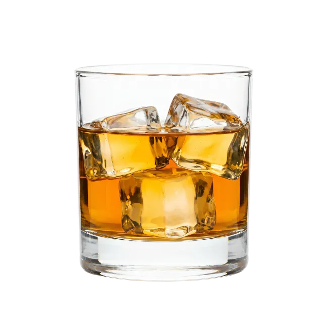 Glass of whiskey with ice cubes