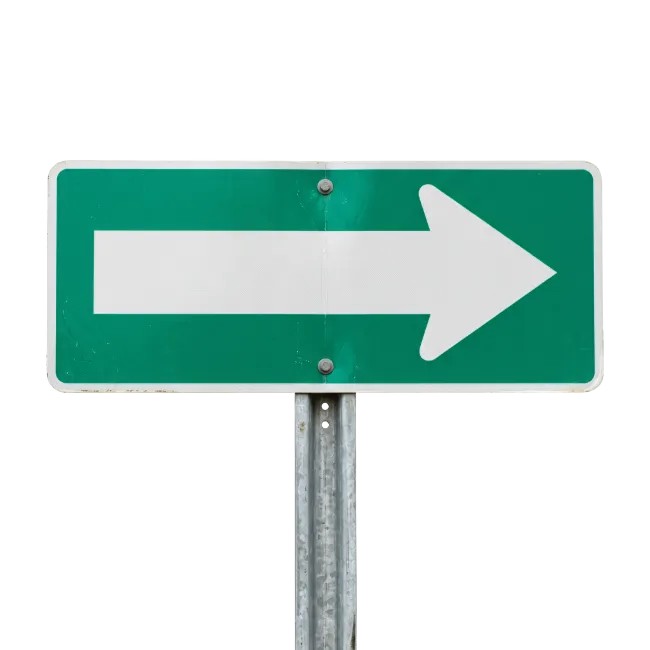 Green and white directional arrow sign