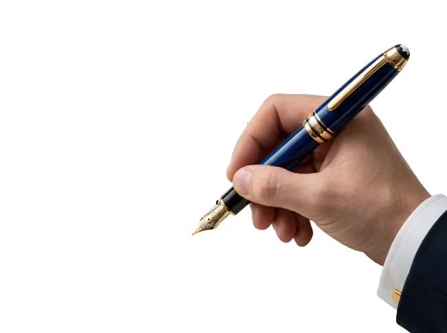 Hand holding a fountain pen writing