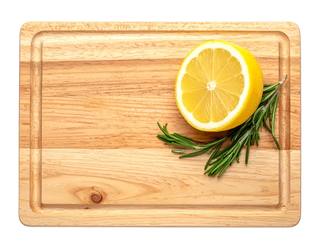 Lemon and Rosemary on Wooden Cutting Board