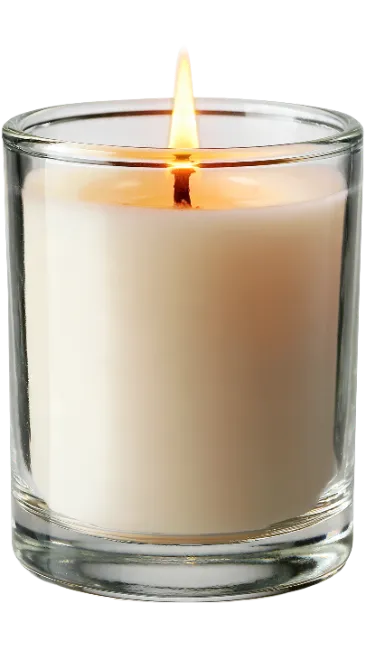 Lit scented candle in a glass jar