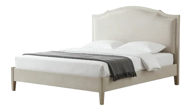 Modern upholstered bed with grey throw blanket