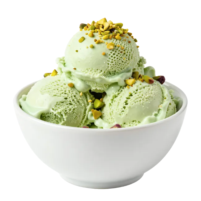Pistachio ice cream scoops in white bowl