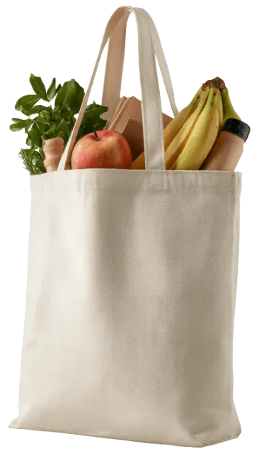 Reusable canvas shopping bag filled with fresh groceries