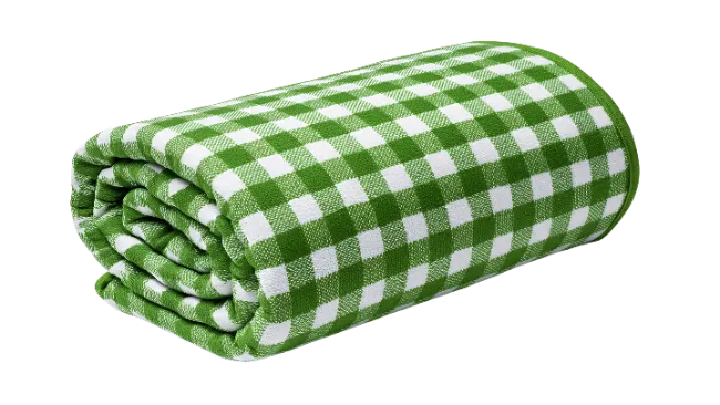 Rolled green and white checkered picnic blanket