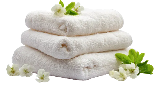 Stack of white fluffy towels with flowers