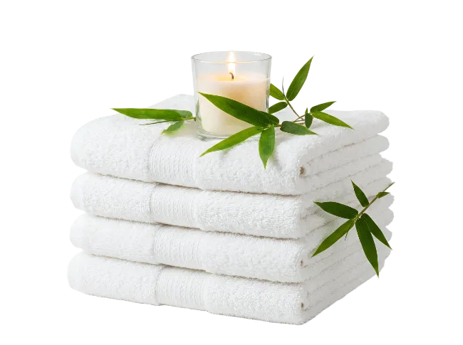 Stacked White Spa Towels With Candle And Bamboo