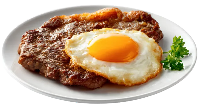 Steak and Fried Egg on Plate