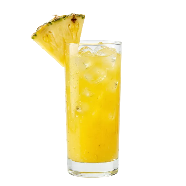 Tall glass of pineapple juice with ice and slice