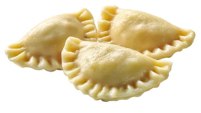 Three Delicious Cooked Pierogies with Crimped Edges