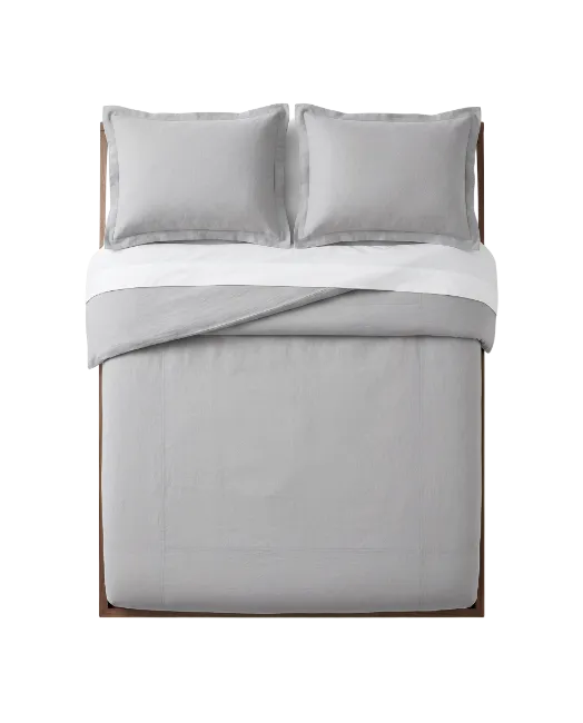 Top View of Grey Bed with Pillows