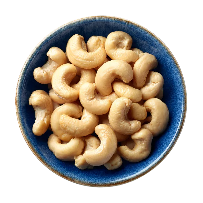 Top view of roasted cashew nuts in a blue ceramic bowl