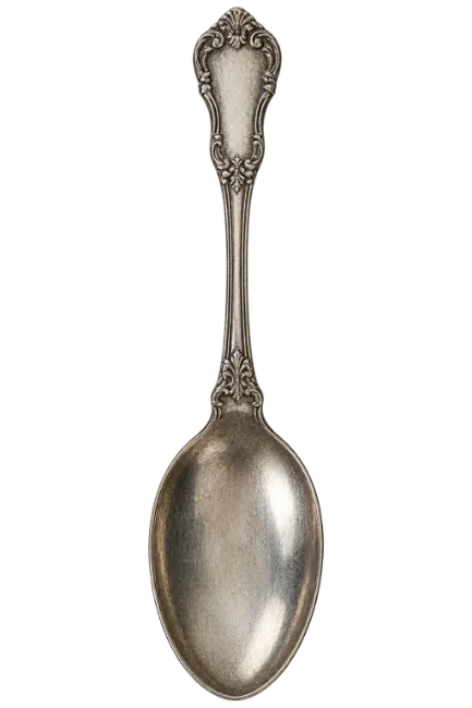 Vintage silver spoon with ornate handle