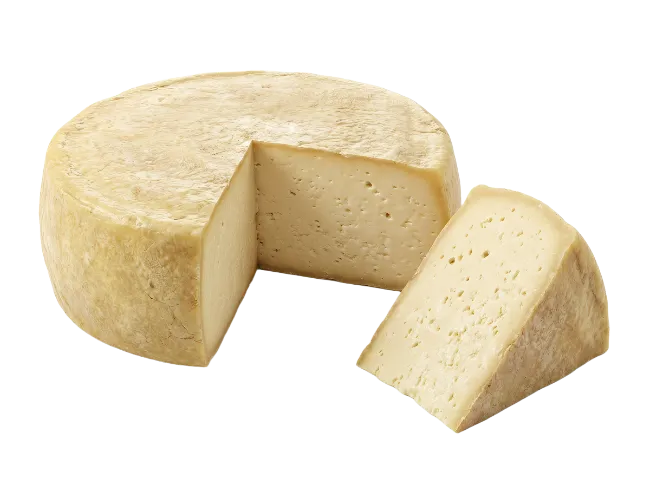 Wheel of artisan aged cheese with a slice cut out