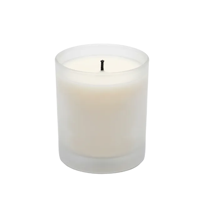 White scented candle in frosted glass jar