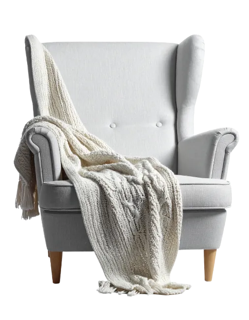 White Wingback Armchair with Knitted Throw Blanket