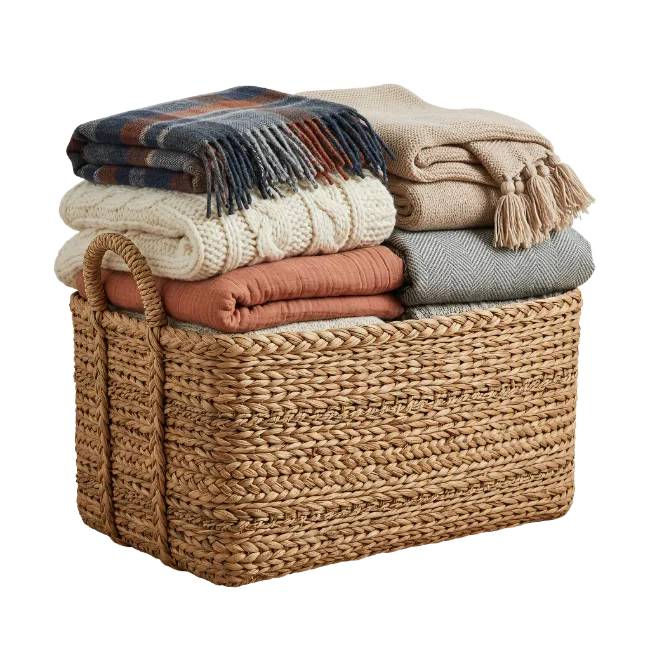 Woven Basket Filled With Cozy Folded Blankets